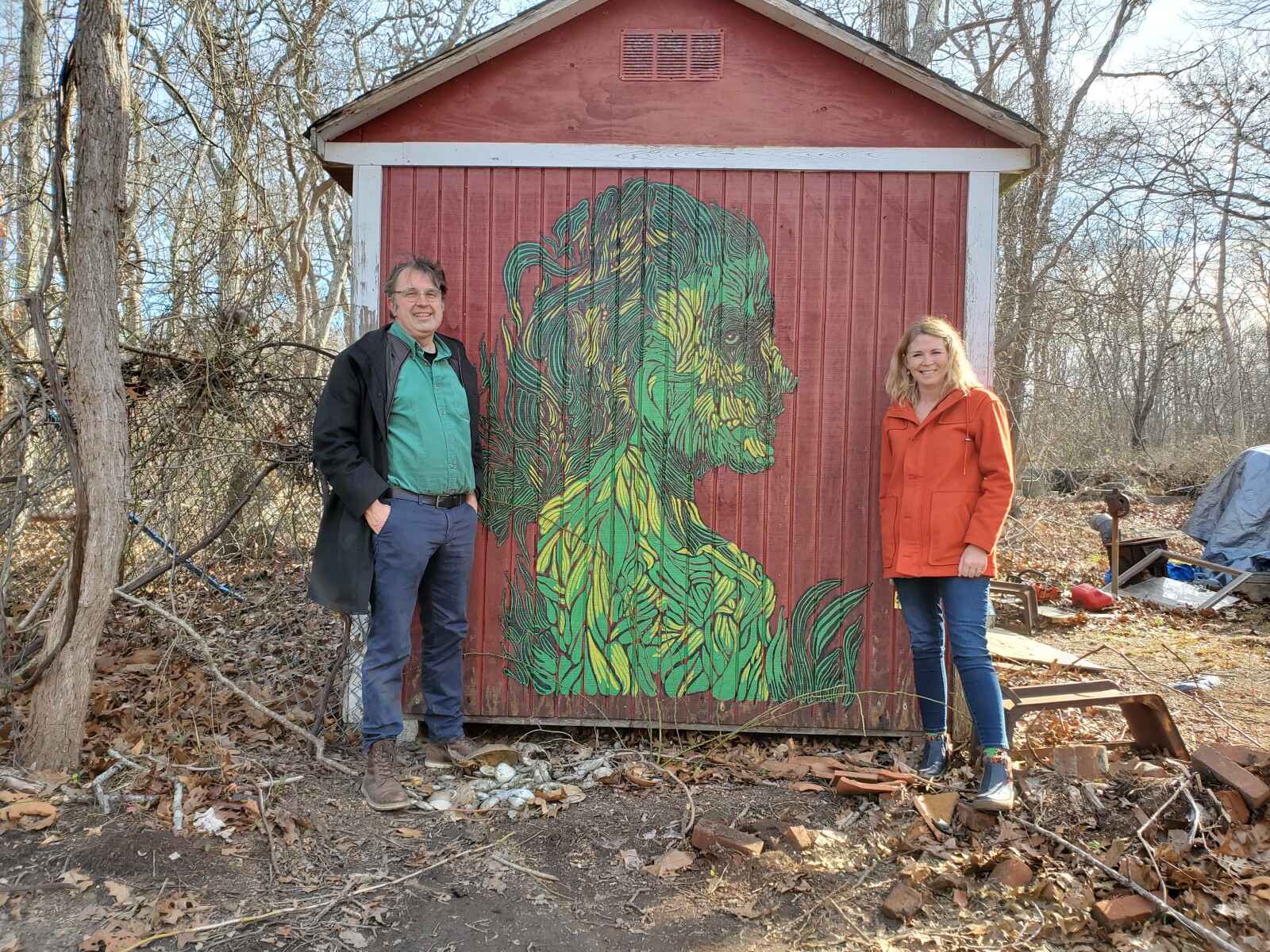 The Long Island Children's Museum staff visiting Ma's House, standing next to a painted mural by Ma's House alumni artist Jacoub Reyes. Photo: courtesy of Jeremy Dennis.