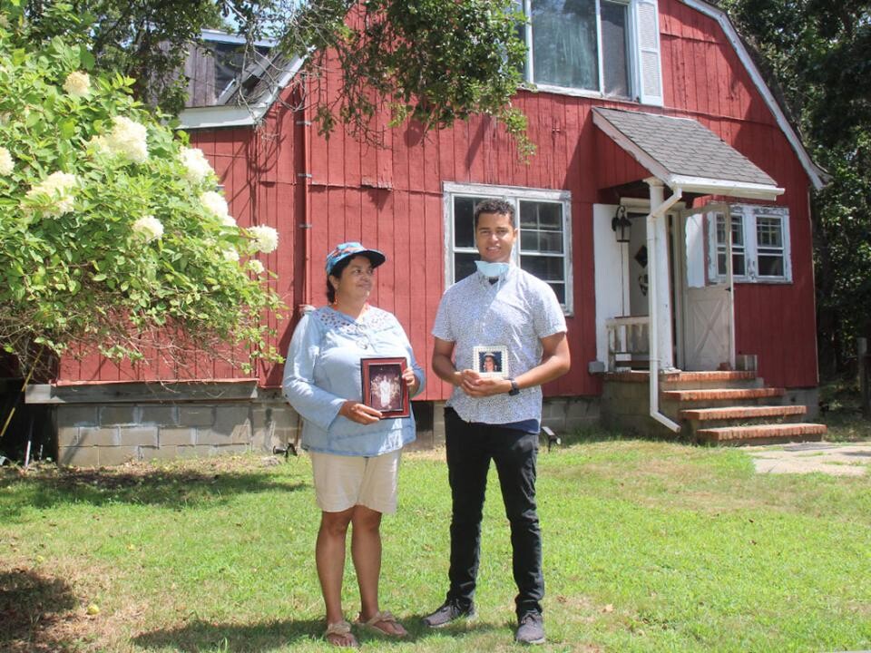 Denise Silva-Dennis and her son, Jeremy Dennis, stood in front of her mother’s house, otherwise known as Ma’s House, on the Shinnecock Reservation. Photo: Durell Godfrey. Courtesy of Jeremy Dennis.