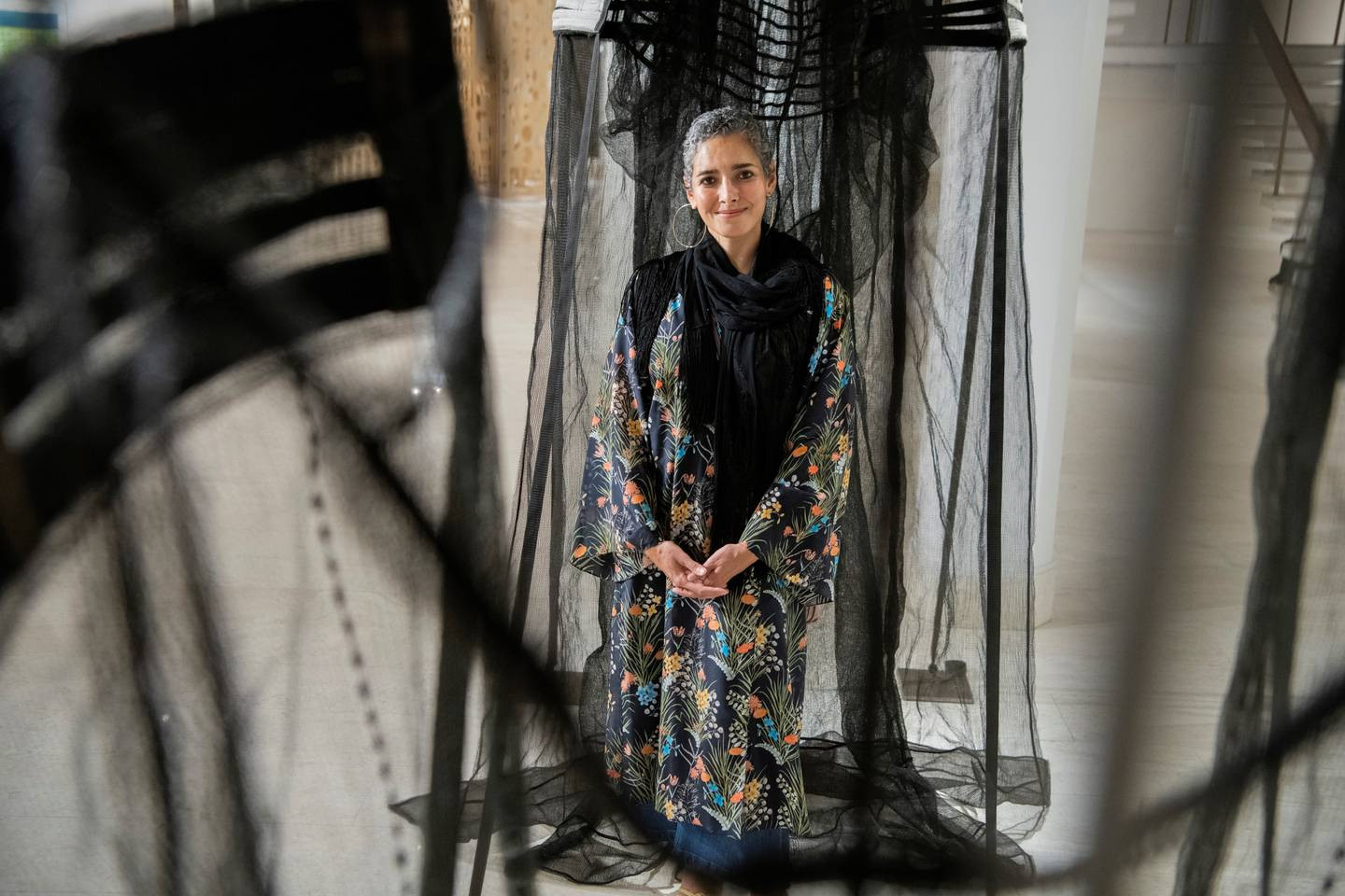 Filwa Nazer's portraits and sculptures made of fabrics, some diaphanous and others opaque, are perhaps impeccable metaphors for the female experience in Saudi Arabia. Nazer in front of 'The Other Is Another Body 2', 2019. Photo: Misk Art Institute